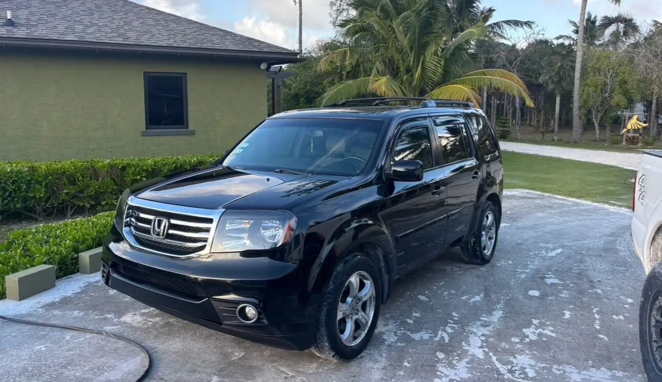 Tyler Car Rentals Honda Pilot parked in Eleuthera